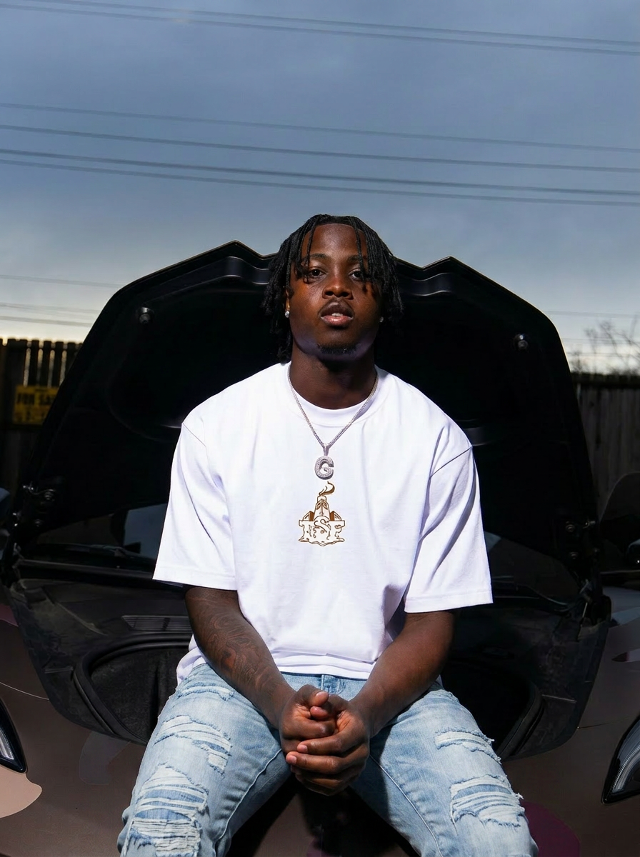 Person sitting inside an open car with a neutral background